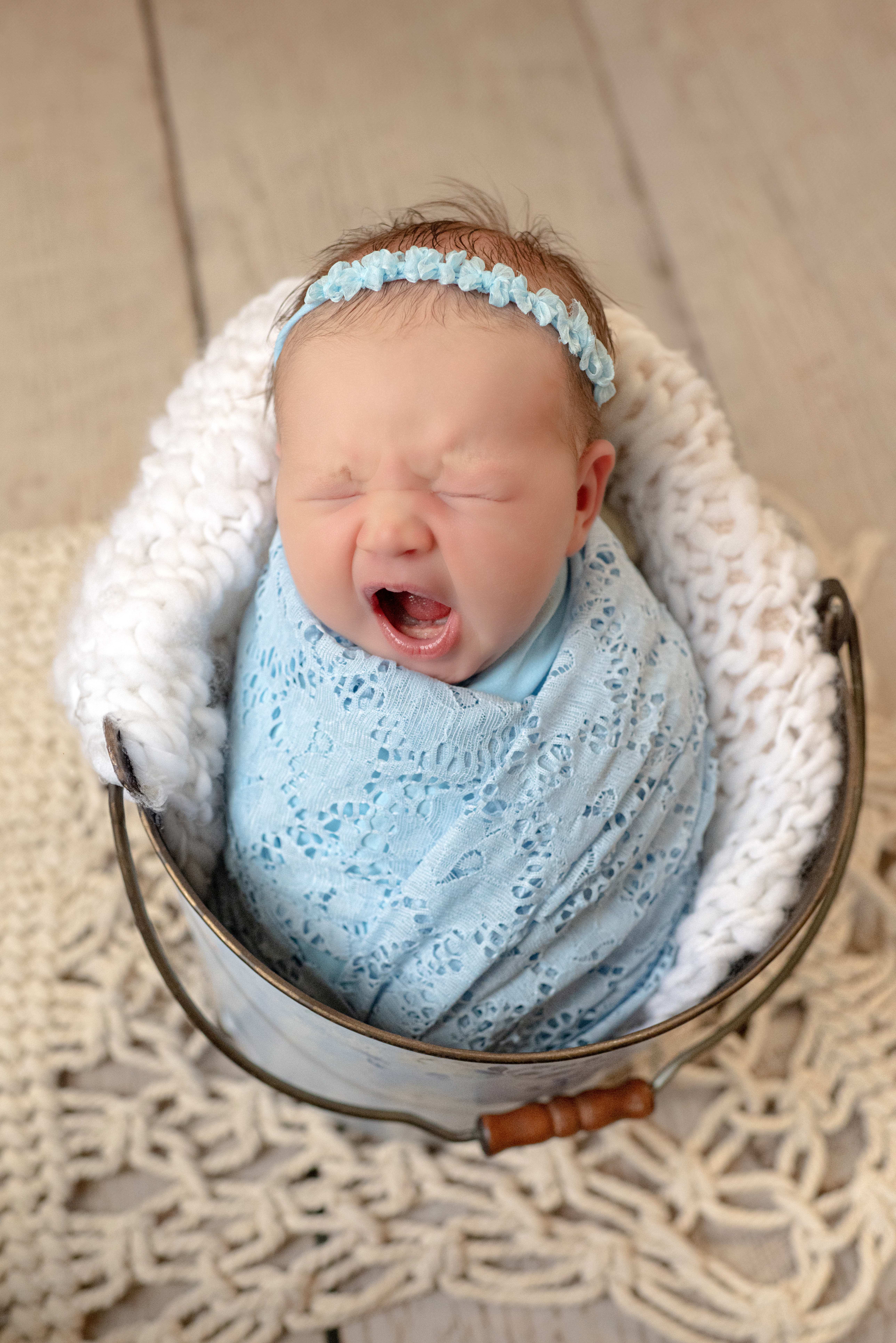grand rapids newborn photography baby blue wrap metal bucket.jpg